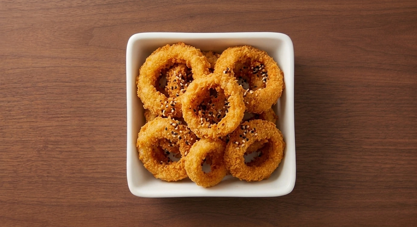 Bonchon onion rings — thick-cut battered onions fried golden and served with ketchup